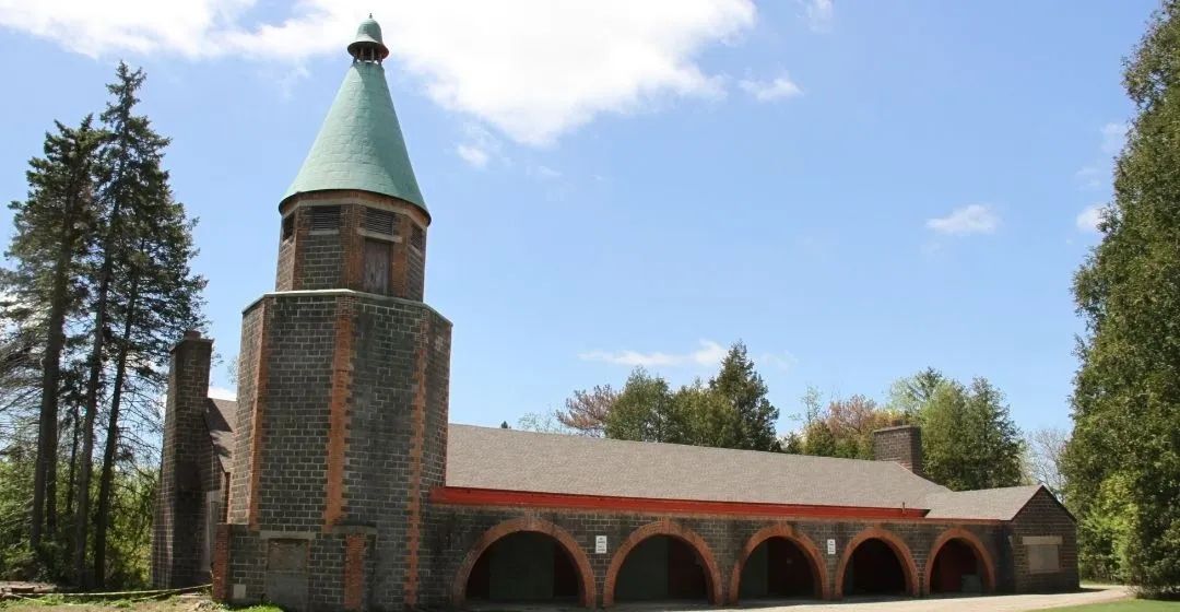 Brady Lodge tower and arched loggia under a blue sky